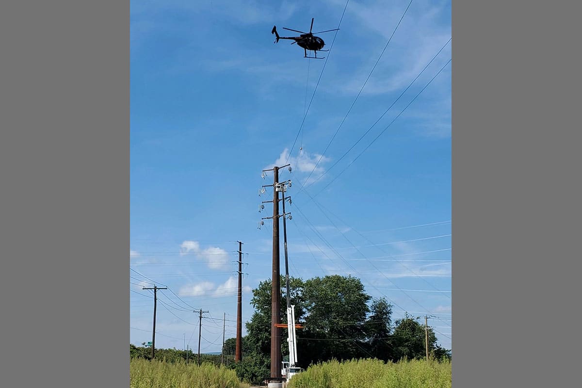 Helicopter above power lines