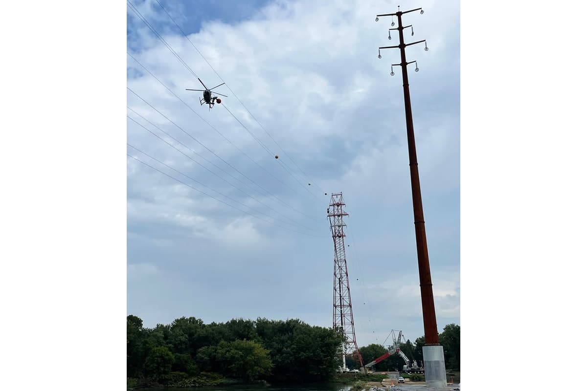Transmission tower and helicopter